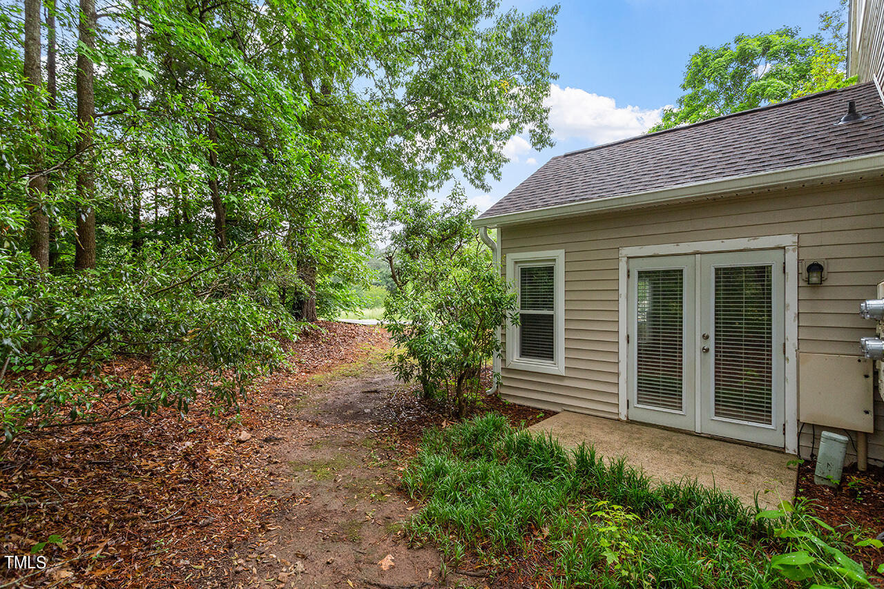 6011 Winterpointe Lane, Unit 104 Raleigh, NC 27606 - Photo 31 of 31 a view of house with backyard and garden