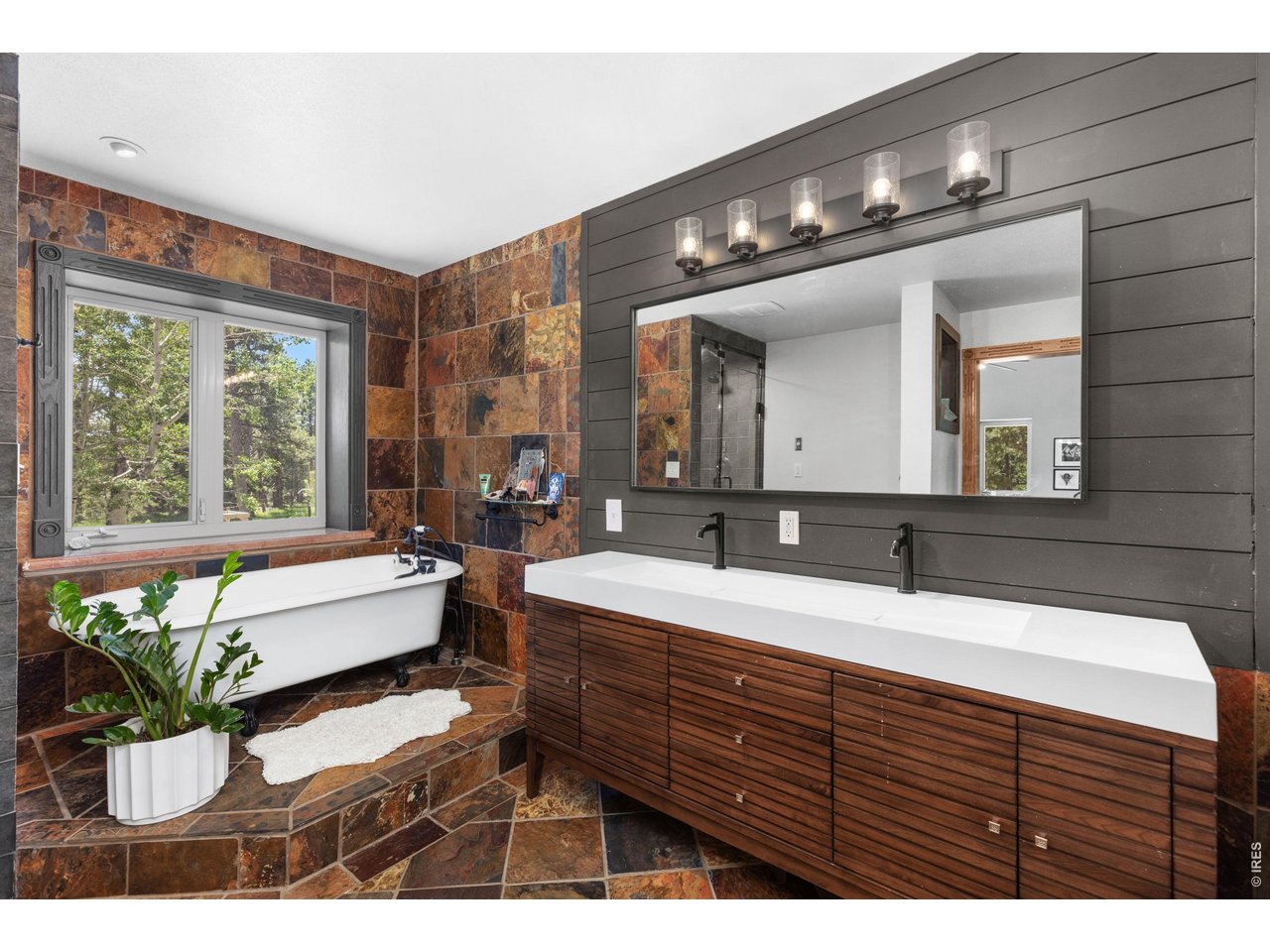 187 Lynx Drive Ward, CO 80481 - Photo 23 of 50 a bathroom with a sink mirror and a bathtub