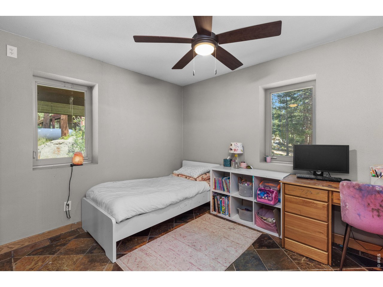 187 Lynx Drive Ward, CO 80481 - Photo 26 of 50 a bedroom with a bed and a desk