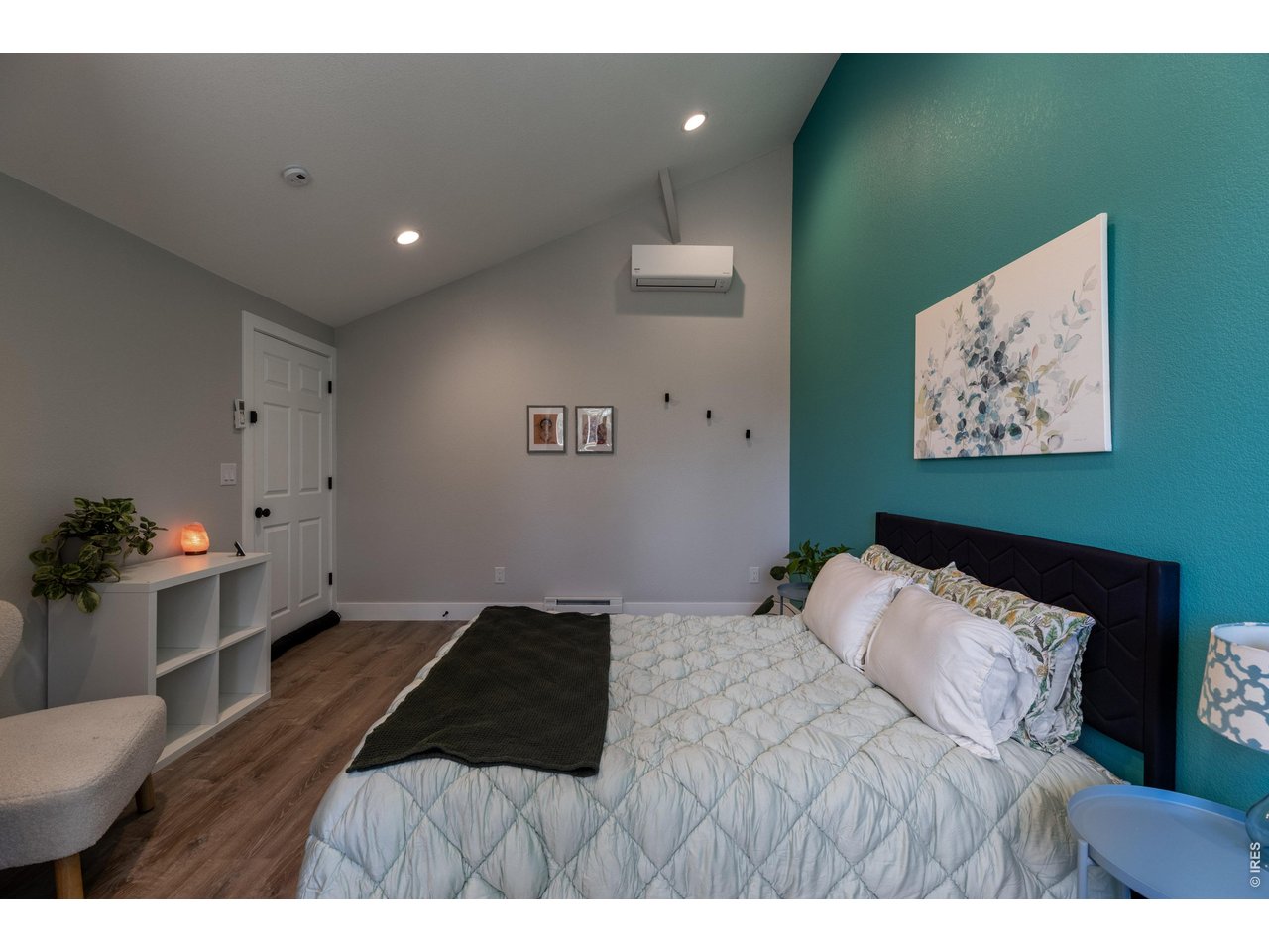 187 Lynx Drive Ward, CO 80481 - Photo 28 of 50 a bedroom with a bed and a painting on the wall