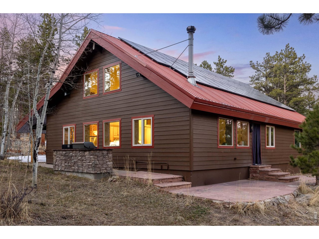 187 Lynx Drive Ward, CO 80481 - Photo 50 of 50 a front view of a house with garden