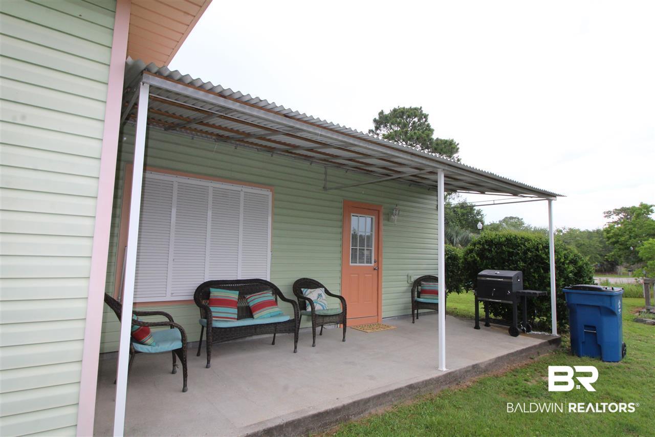 4374 Lindsey Lane, Unit 4374A Orange Beach, AL 36561 - Photo 6 of 20 Covered back Patio with Outside storage and grill.