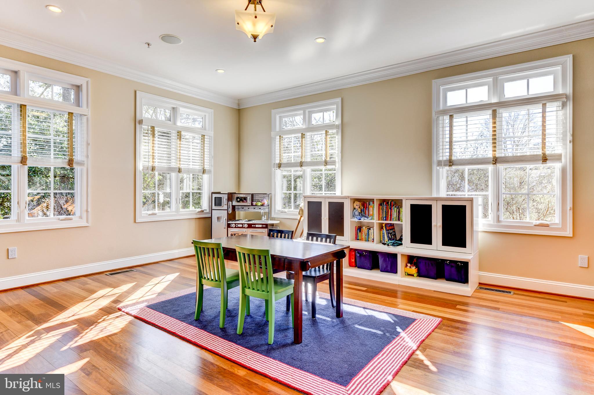 8603 Rayburn Road Bethesda, MD 20817 - Photo 14 of 67 Club room with 2-sided gas fireplace