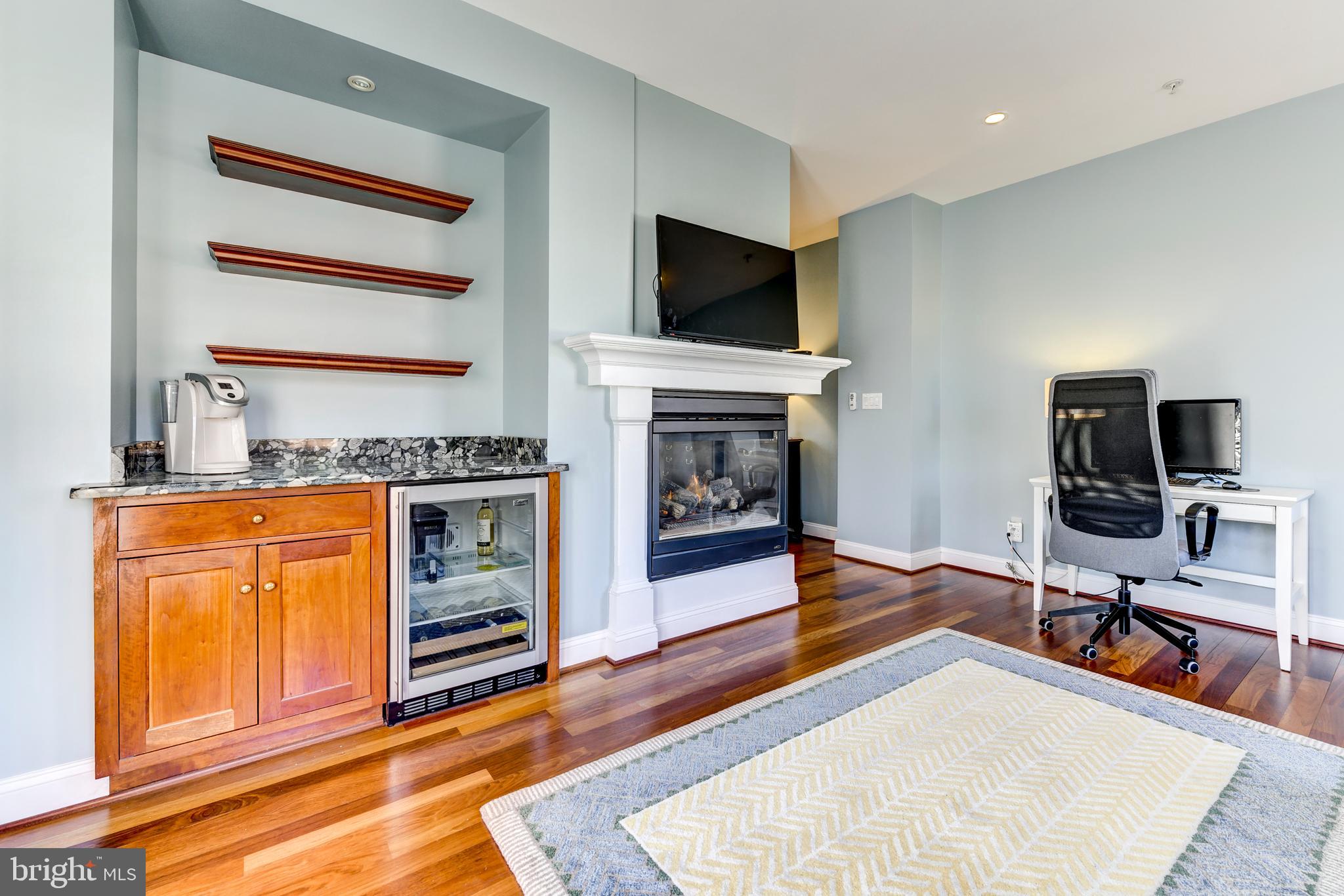 8603 Rayburn Road Bethesda, MD 20817 - Photo 33 of 67 Sitting room with gas fireplace and coffee bar