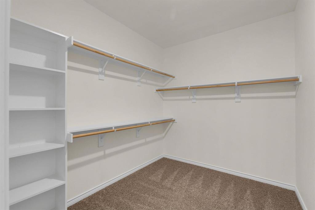 3106 Maverick Drive Forney, TX 75126 - Photo 19 of 32 a view of an empty walk in closet