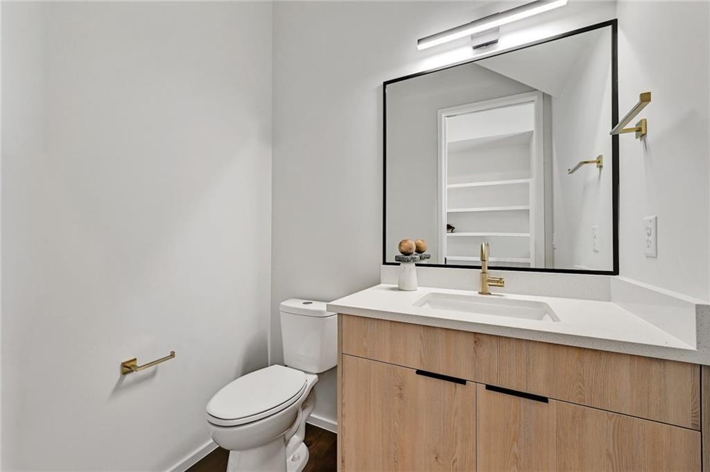 1904 Collier Street Austin, TX 78704 - Photo 15 of 31 a bathroom with a sink toilet and mirror