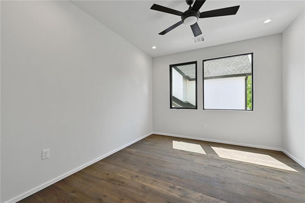 1904 Collier Street Austin, TX 78704 - Photo 18 of 31 a view of empty room with wooden floor and fan
