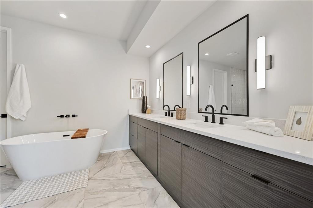 1904 Collier Street Austin, TX 78704 - Photo 22 of 31 a bathroom with a double vanity sink mirror and bathtub