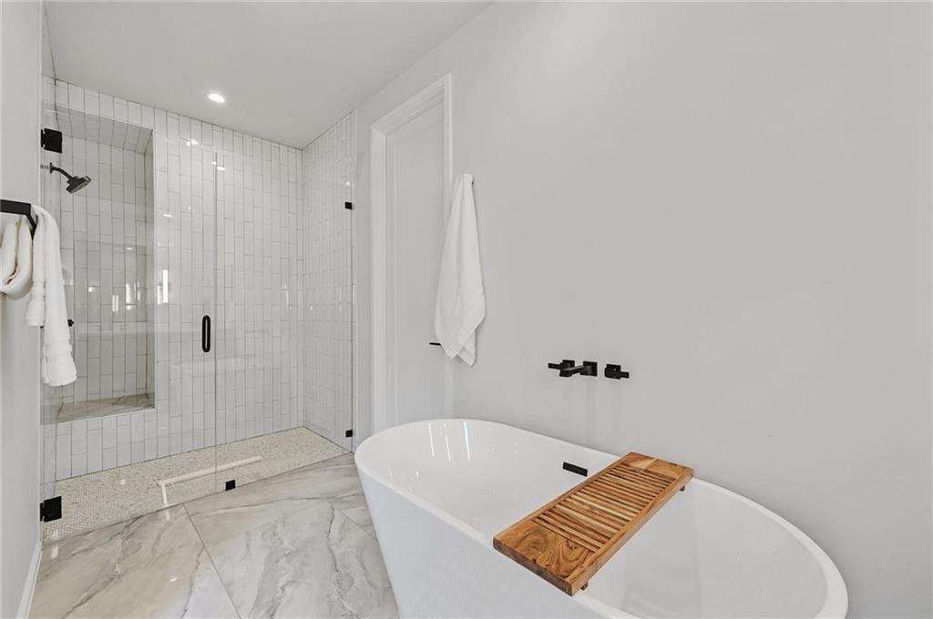1904 Collier Street Austin, TX 78704 - Photo 23 of 31 a bathroom with a tub shower and vanity