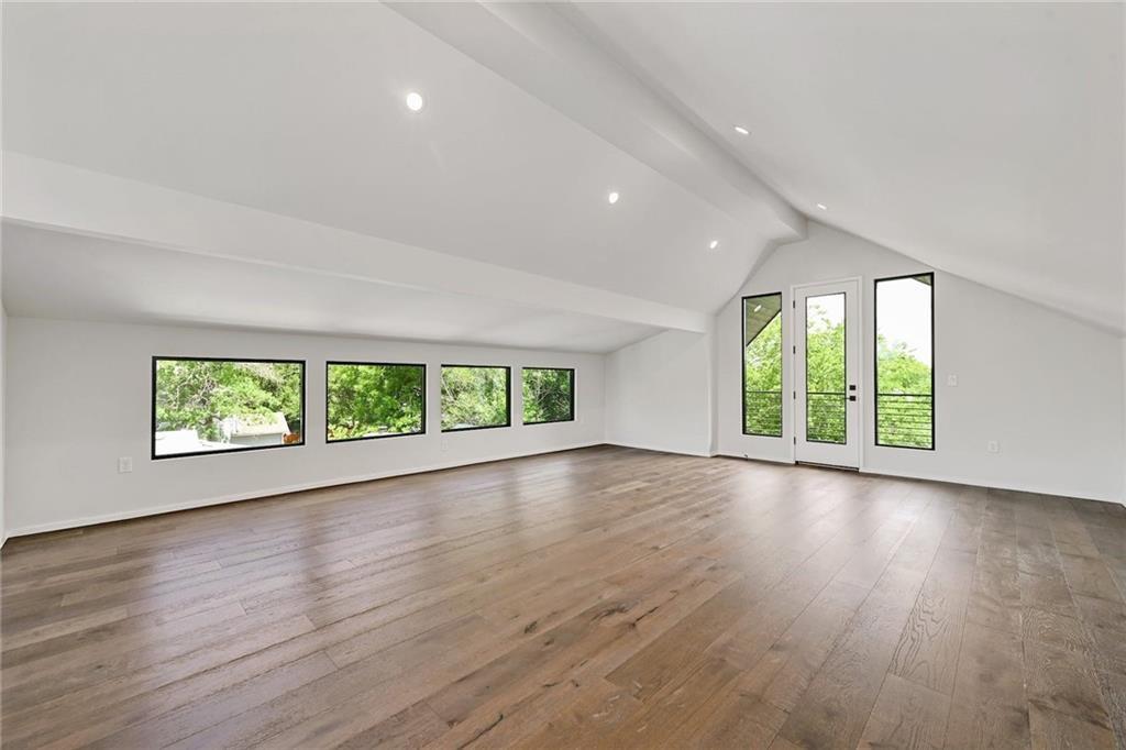 1904 Collier Street Austin, TX 78704 - Photo 25 of 31 an empty room with wooden floor and windows