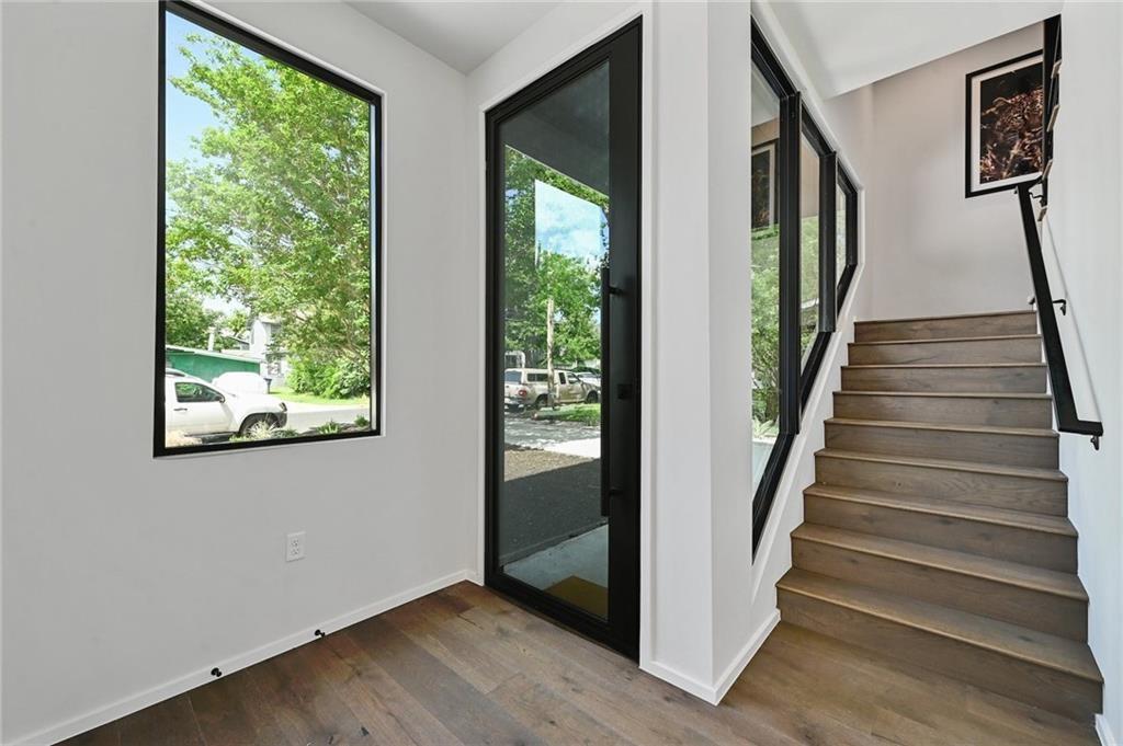 1904 Collier Street Austin, TX 78704 - Photo 5 of 31 a view of staircase with wooden floor and windows