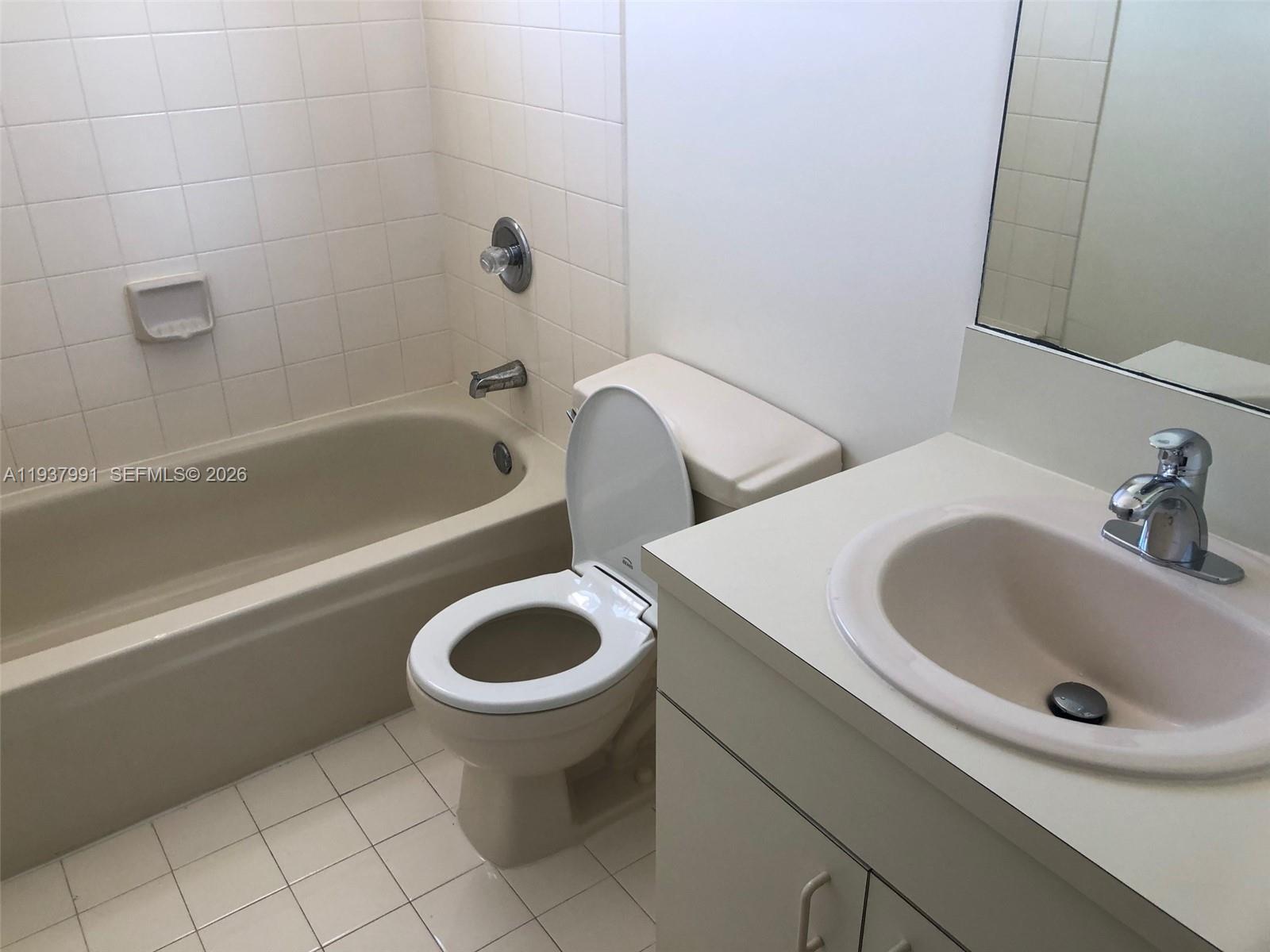 11274 Southwest 64th Lane Miami, FL 33173 - Photo 9 of 34 a bathroom with a sink and a bathtub