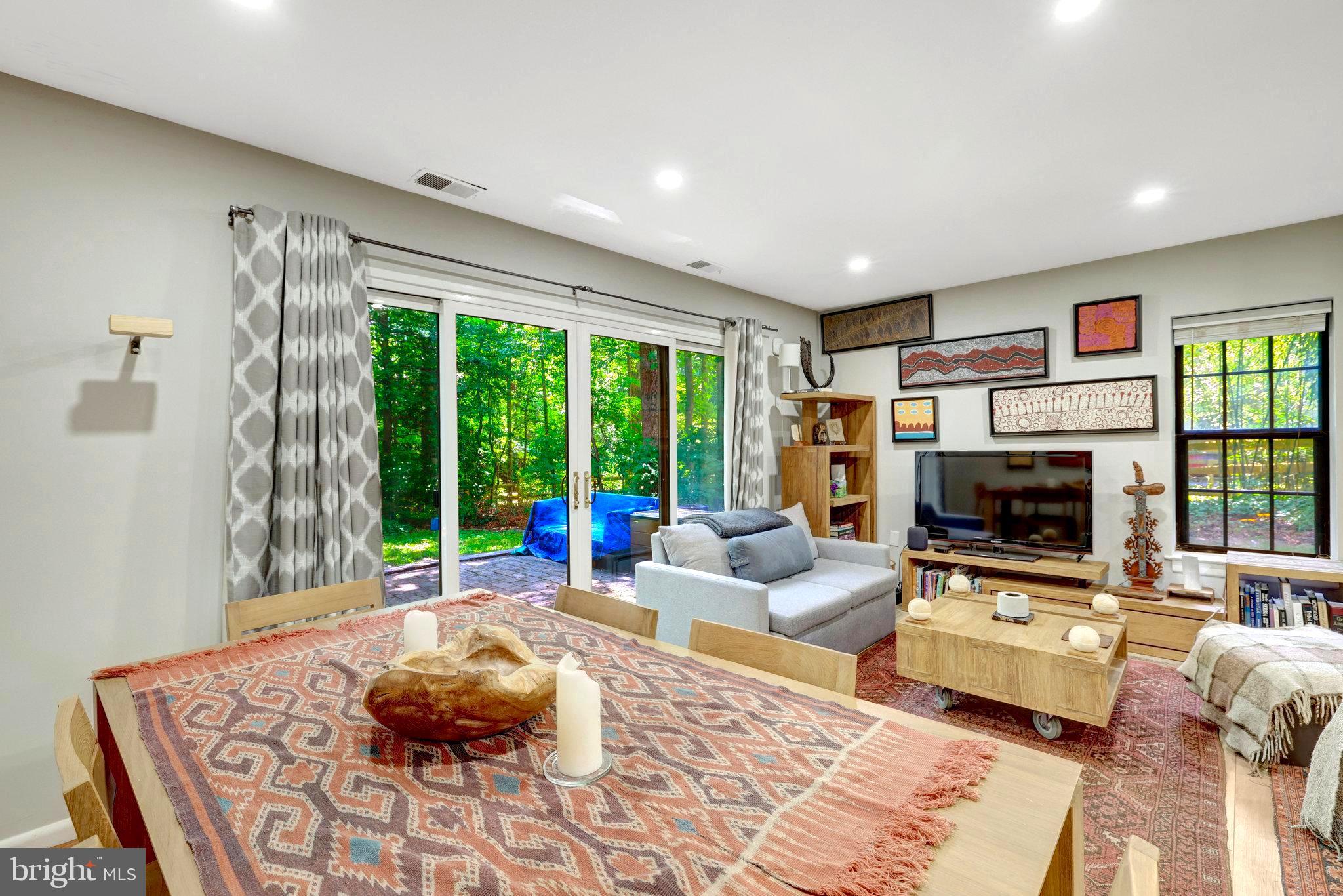 2045 Headlands Circle Reston, VA 20191 - Photo 19 of 32 a living room with furniture large window and a flat screen tv