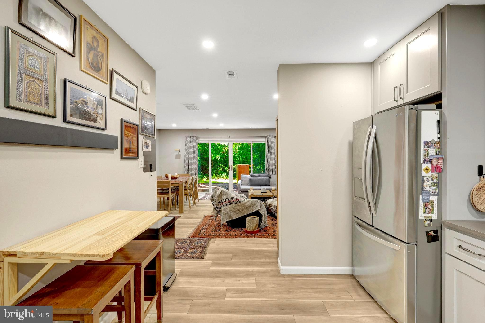 2045 Headlands Circle Reston, VA 20191 - Photo 23 of 32 a kitchen with stainless steel appliances a refrigerator and a table