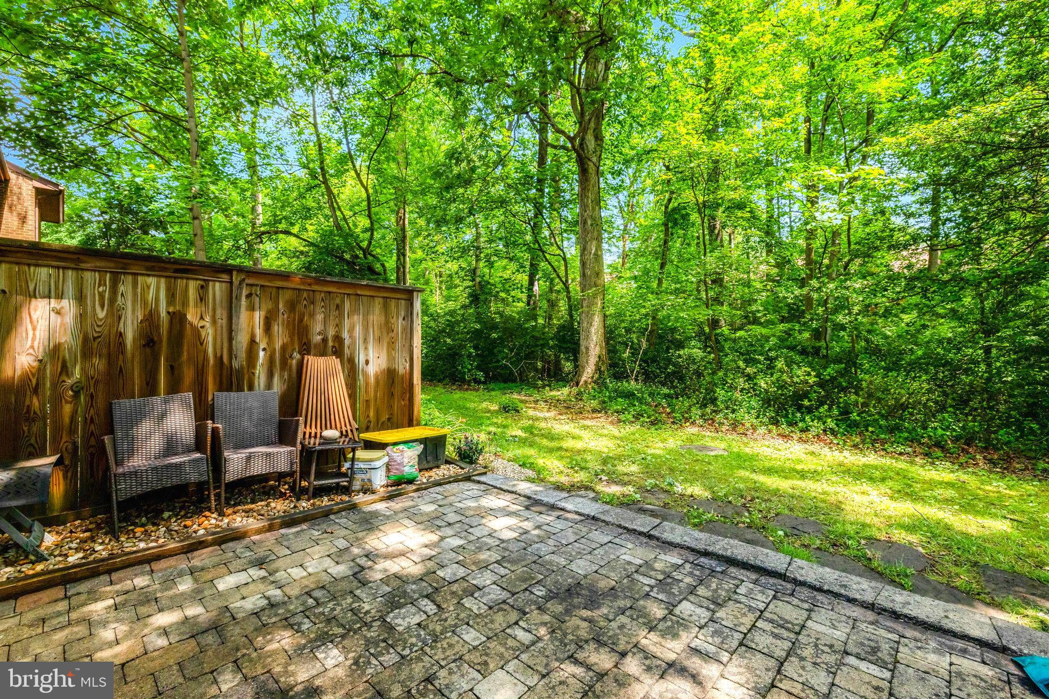2045 Headlands Circle Reston, VA 20191 - Photo 28 of 32 a view of a backyard with chairs a barbeque and wooden fence