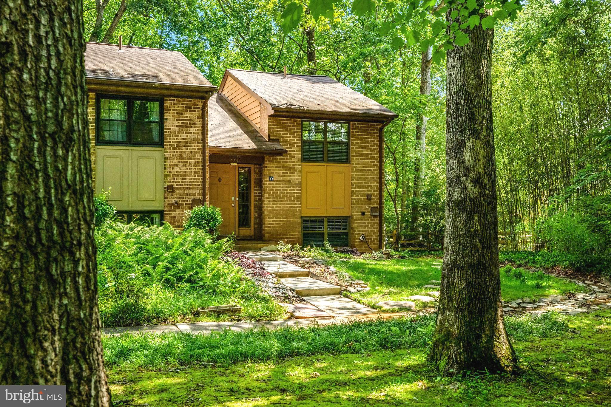 2045 Headlands Circle Reston, VA 20191 - Photo 30 of 32 a front view of a house with garden