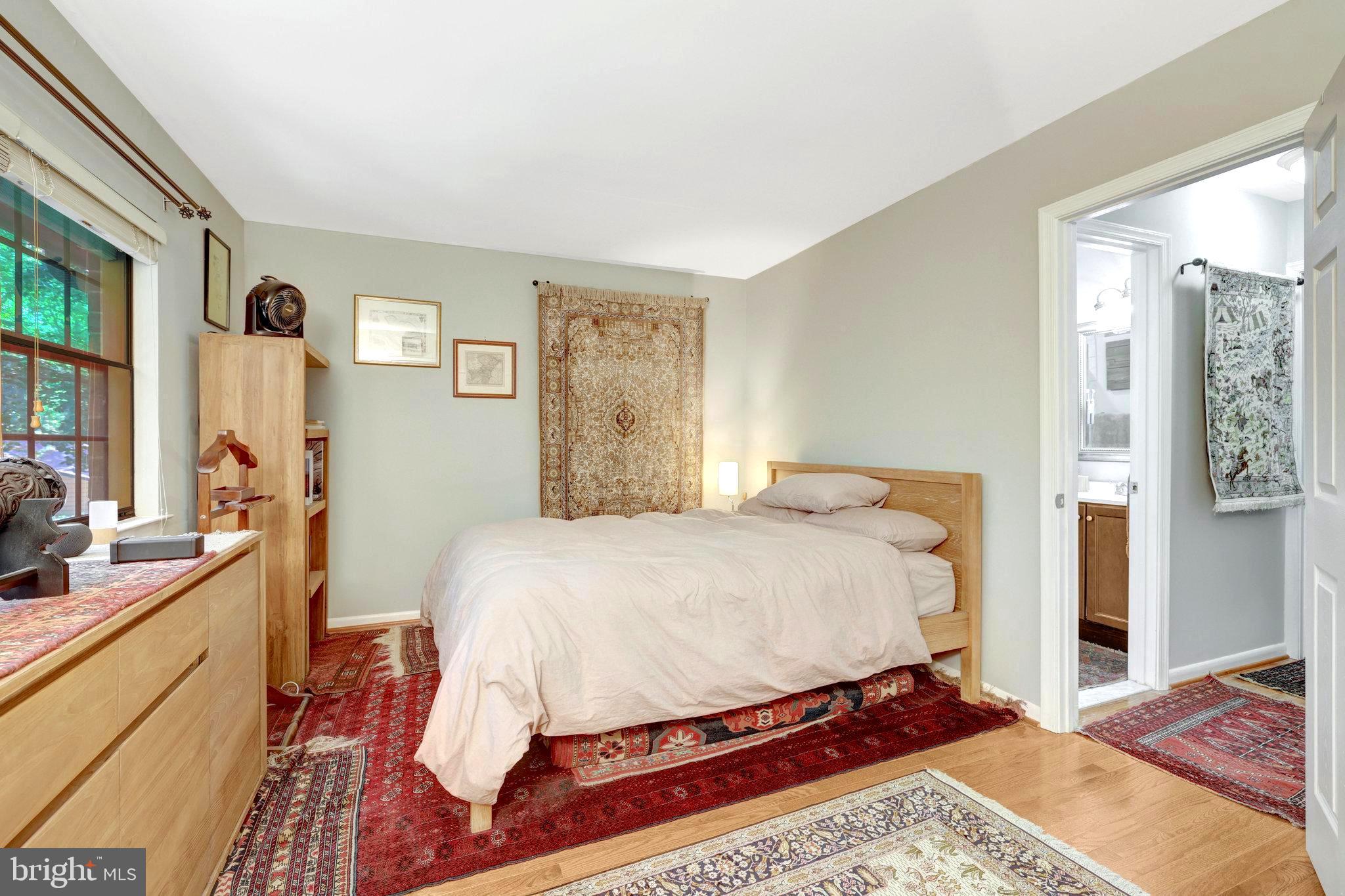 2045 Headlands Circle Reston, VA 20191 - Photo 5 of 32 a bed sitting in a bedroom next to a window