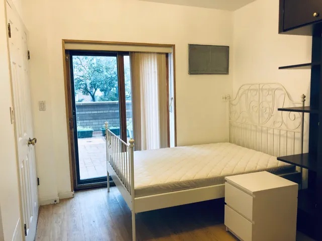 a bedroom with a bed and a table