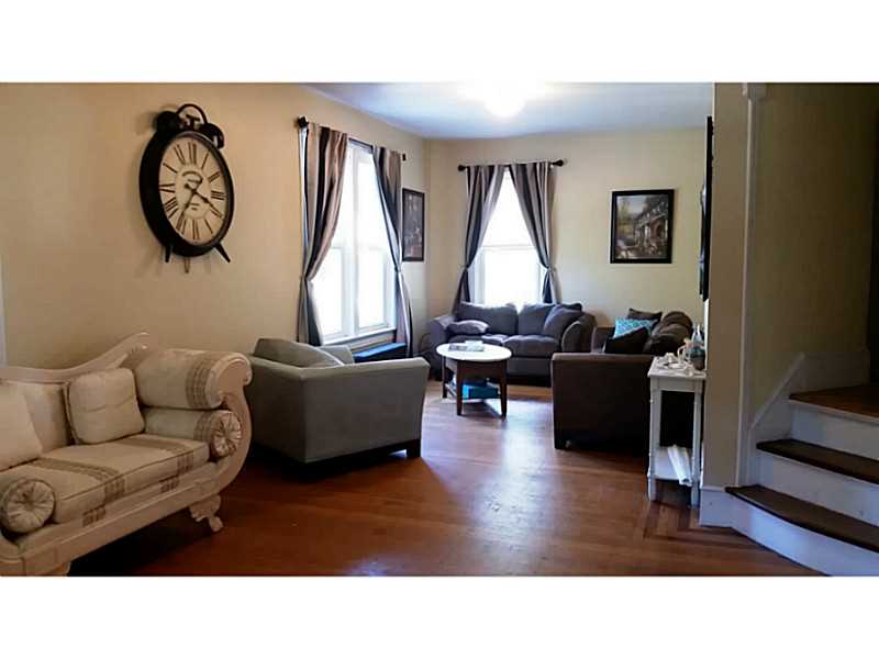 30 Maple Street Woonsocket, RI 02895 - Photo 3 of 24 Living Room. Owners Unit - Gleaming Hardwood Floors, unique wood trim and details throughout