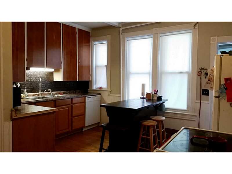 30 Maple Street Woonsocket, RI 02895 - Photo 8 of 24 Kitchen. Gorgeous Light Filled Kitchen w/Hardwood Floors, Maple Cabinets, Tin Backsplash
