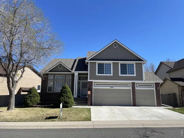 a front view of a house with garage