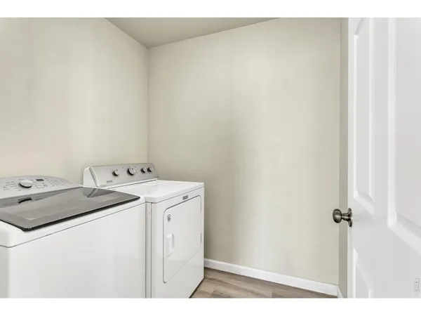 a bathroom with a granite countertop sink mirror vanity and toilet