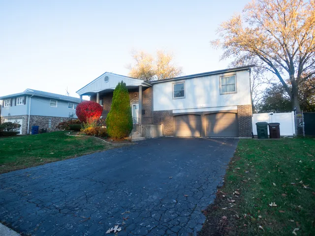 a front view of house with yard and outdoor seating