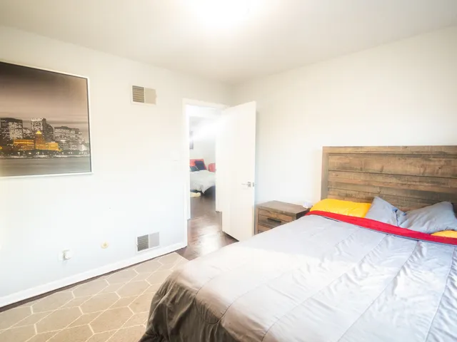 a bedroom with a bed and a couch