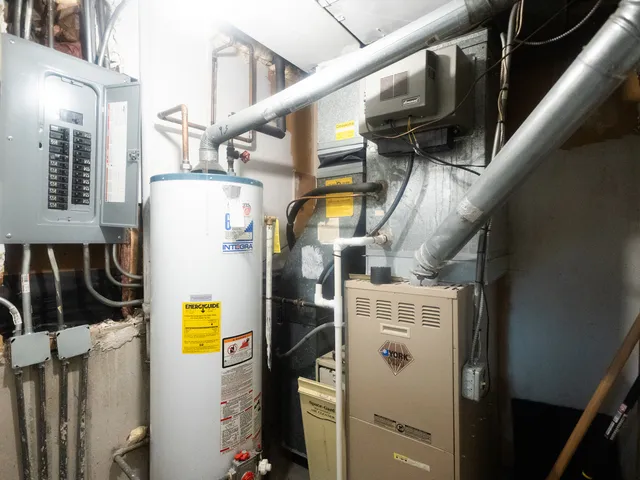 a close up of a storage and utility room with washer and dryer