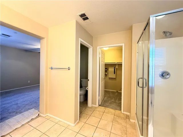 a view of a bathroom with a glass door