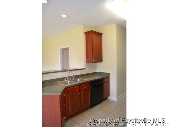 3516 Talus Road Fayetteville, NC 28306 - Photo 10 of 19 a bathroom with a sink and a mirror