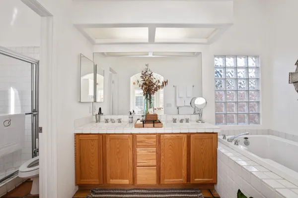 walk in closet with wooden floor and window