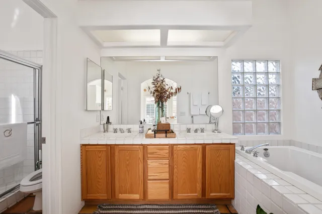 walk in closet with wooden floor and window