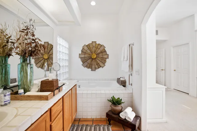 a bedroom with a large bed and a large window