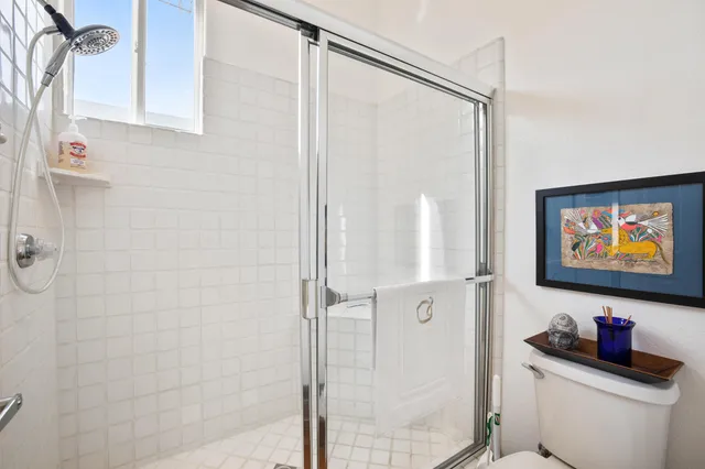 a bedroom with a large bed and a tv