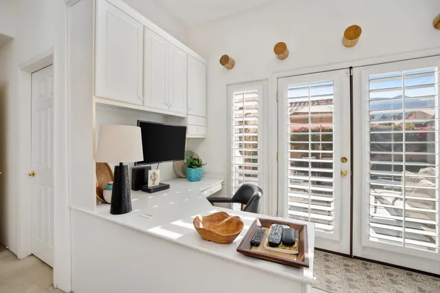a view of a hallway view with wooden floor and staircase