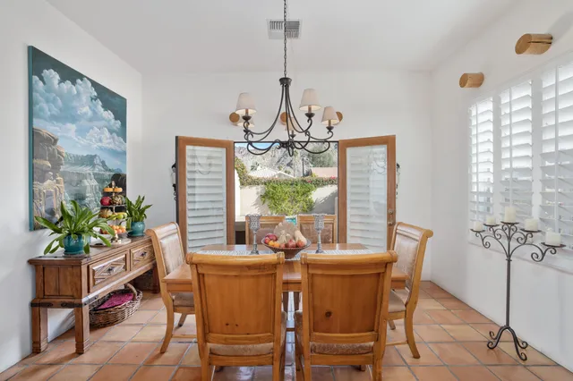 a kitchen with stainless steel appliances granite countertop a stove a sink a microwave and a refrigerator