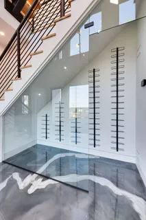 a large kitchen with kitchen island a large island in it