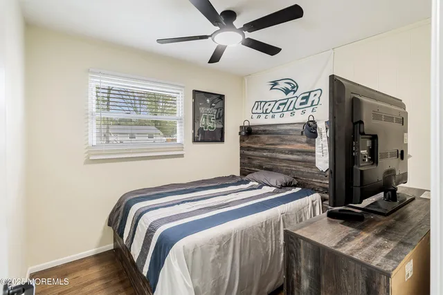 a bedroom with bed and a window