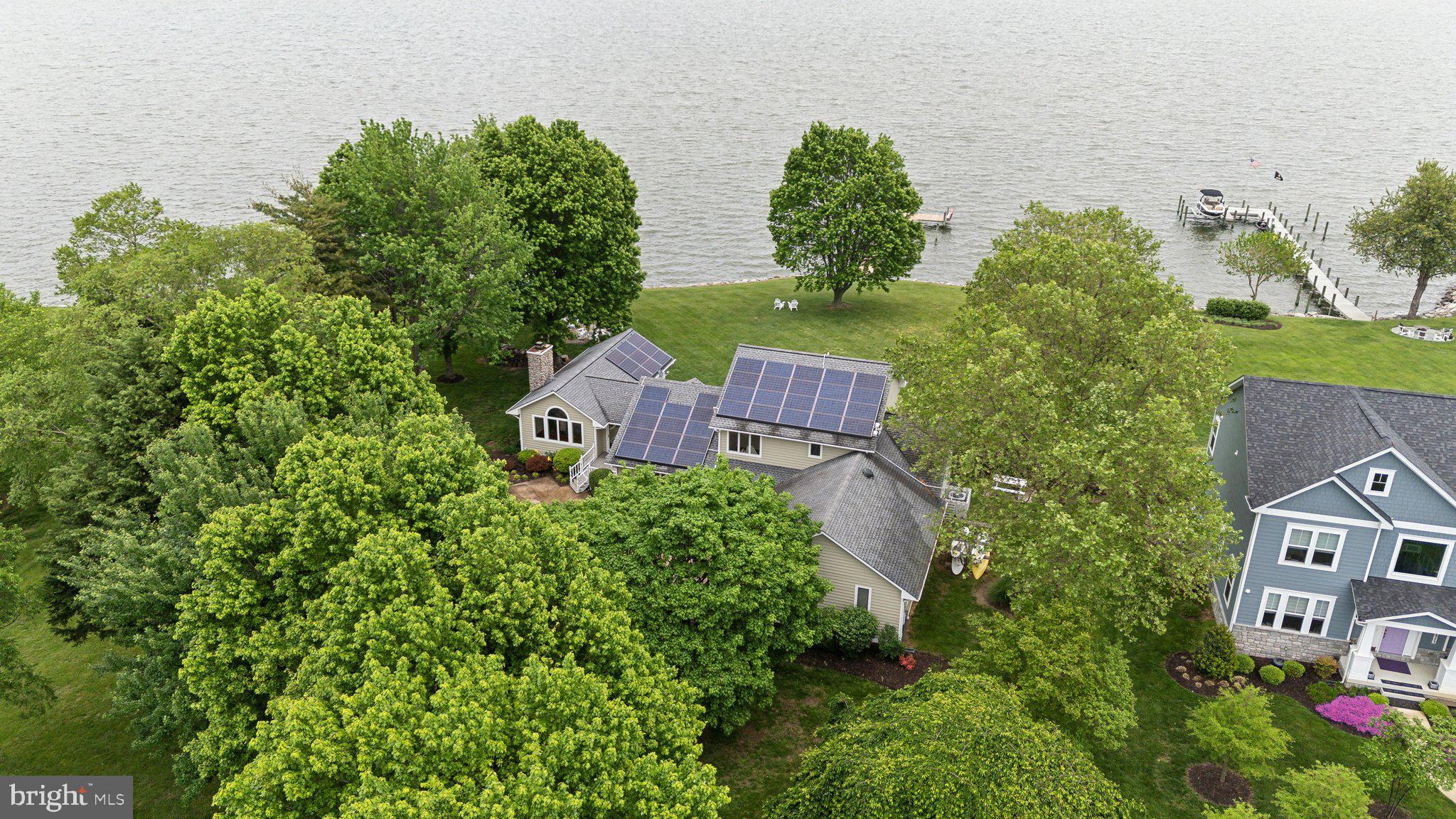 2921 Cox Neck Road East Chester, MD 21619 - Photo 48 of 66 an aerial view of a house with outdoor space and street view