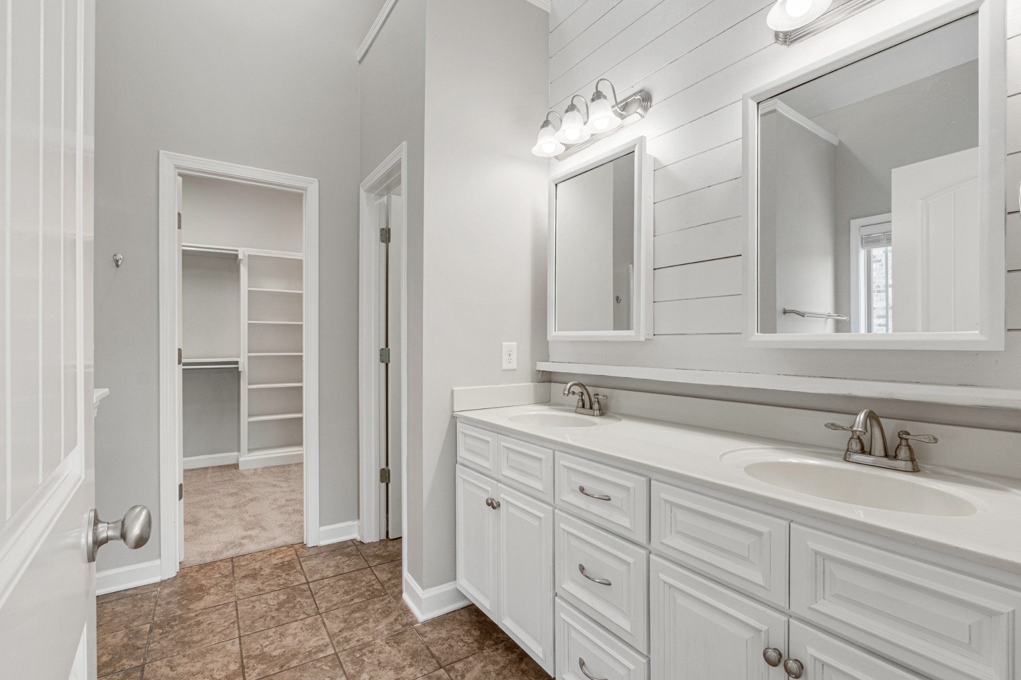 5007 Speight Street Spring Hill, TN 37174 - Photo 15 of 33 a spacious bathroom with double sink and a mirror