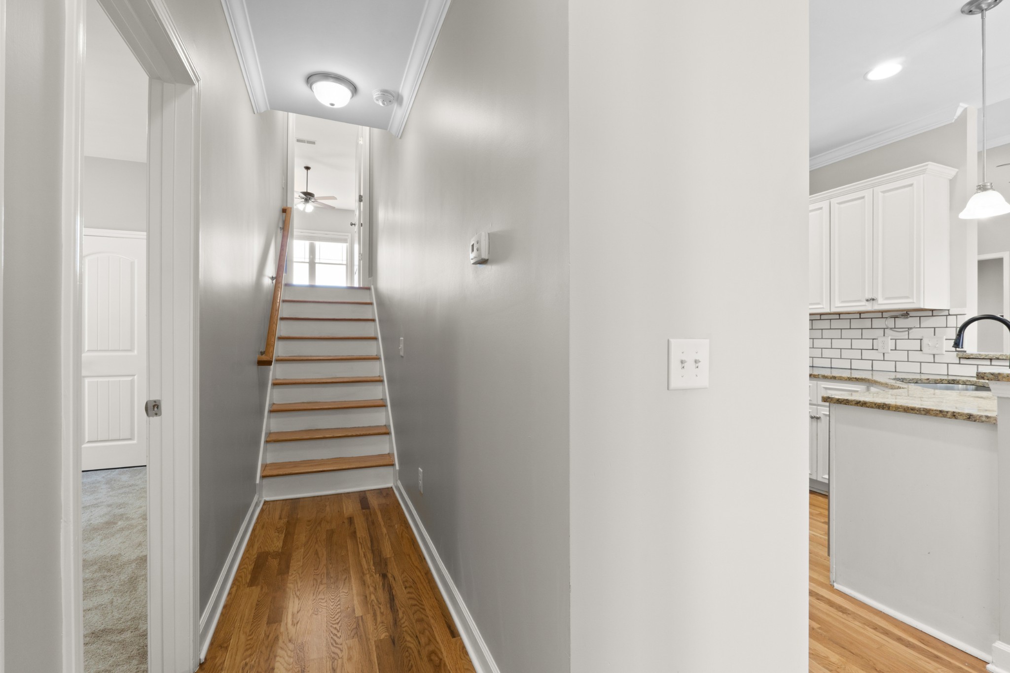 5007 Speight Street Spring Hill, TN 37174 - Photo 23 of 33 a view of a hallway with wooden floor and staircase