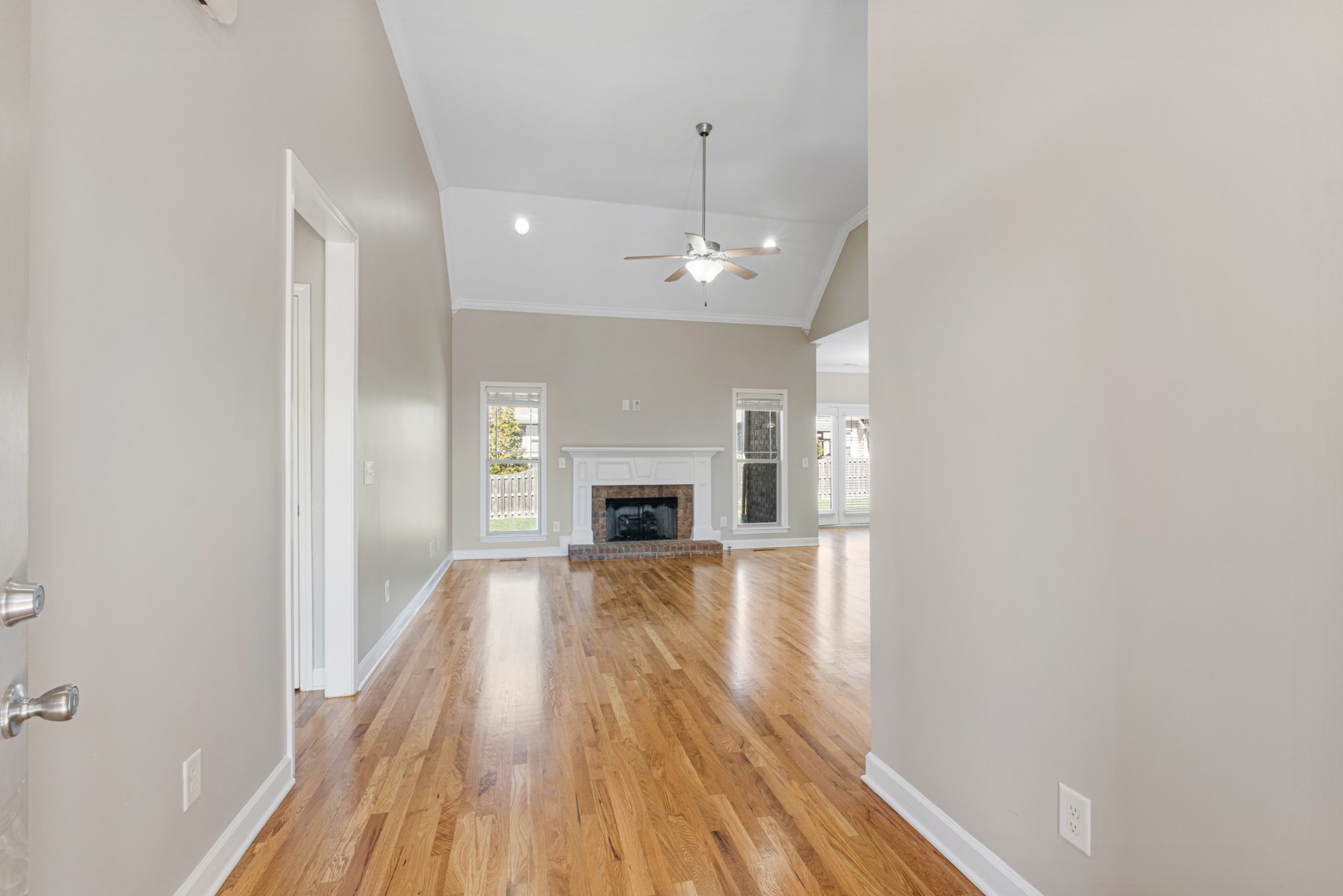 5007 Speight Street Spring Hill, TN 37174 - Photo 3 of 33 wooden floor in an empty room with a fireplace