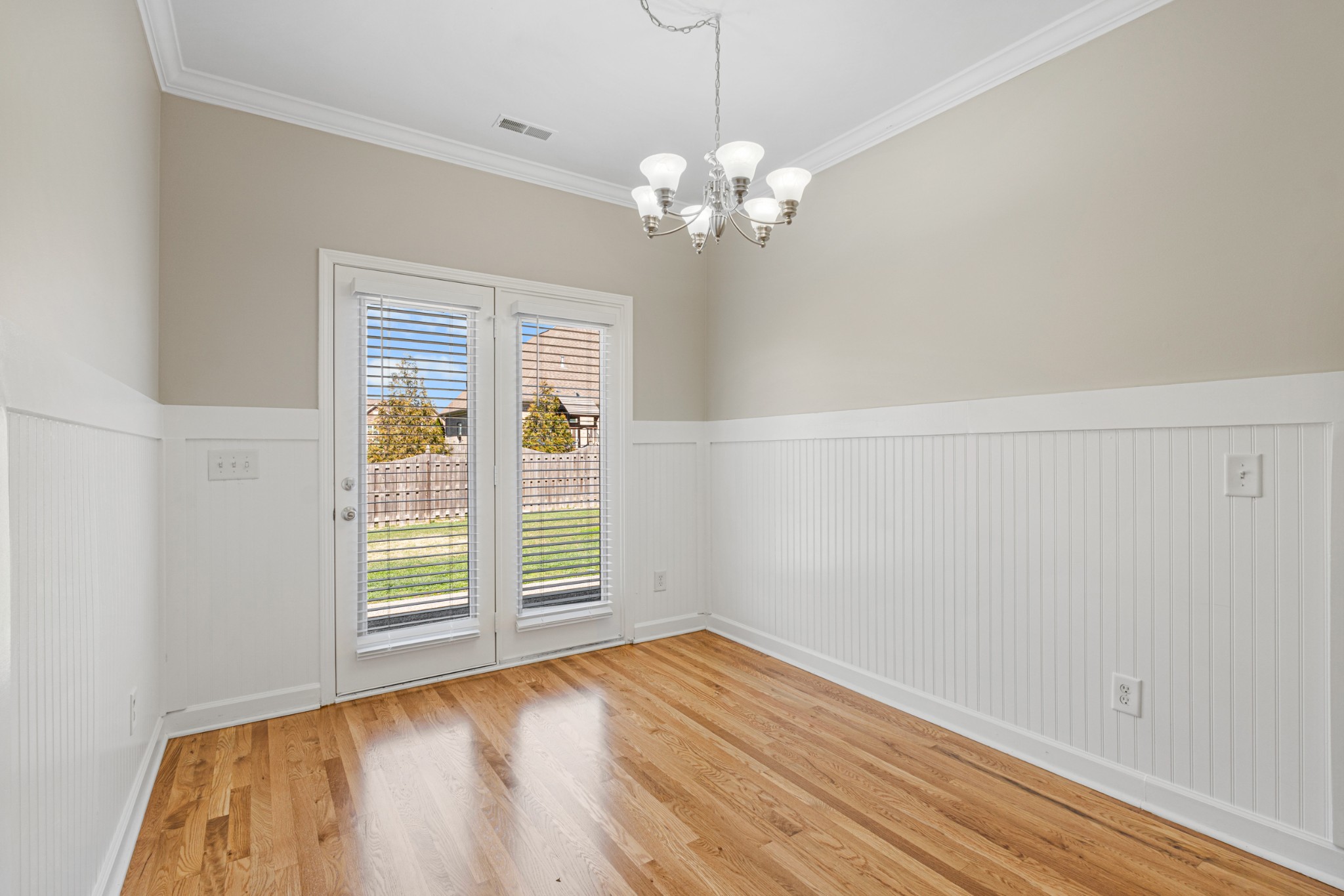 5007 Speight Street Spring Hill, TN 37174 - Photo 7 of 33 a view of empty room with wooden floor and fan