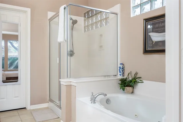 a bathroom with a tub and shower