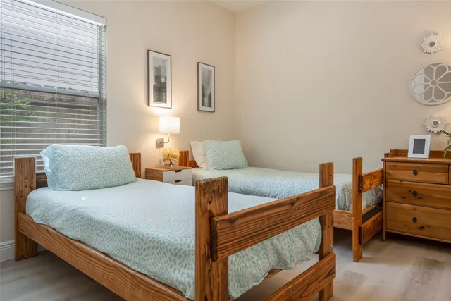 a bedroom with a bed and dresser