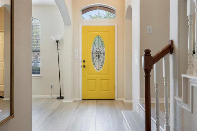 a view of front door with wooden floor