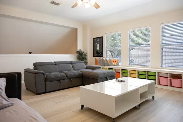 a living room with furniture and a large window