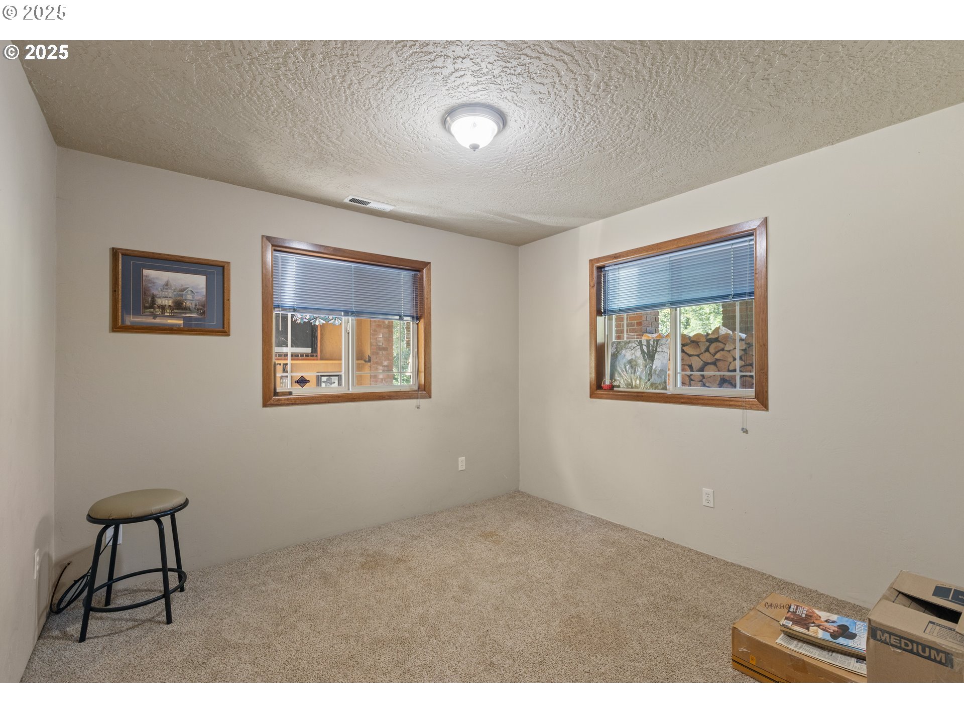 913 Starveout Creek Road Azalea, OR 97410 - Photo 20 of 27 a view of an empty room with a window