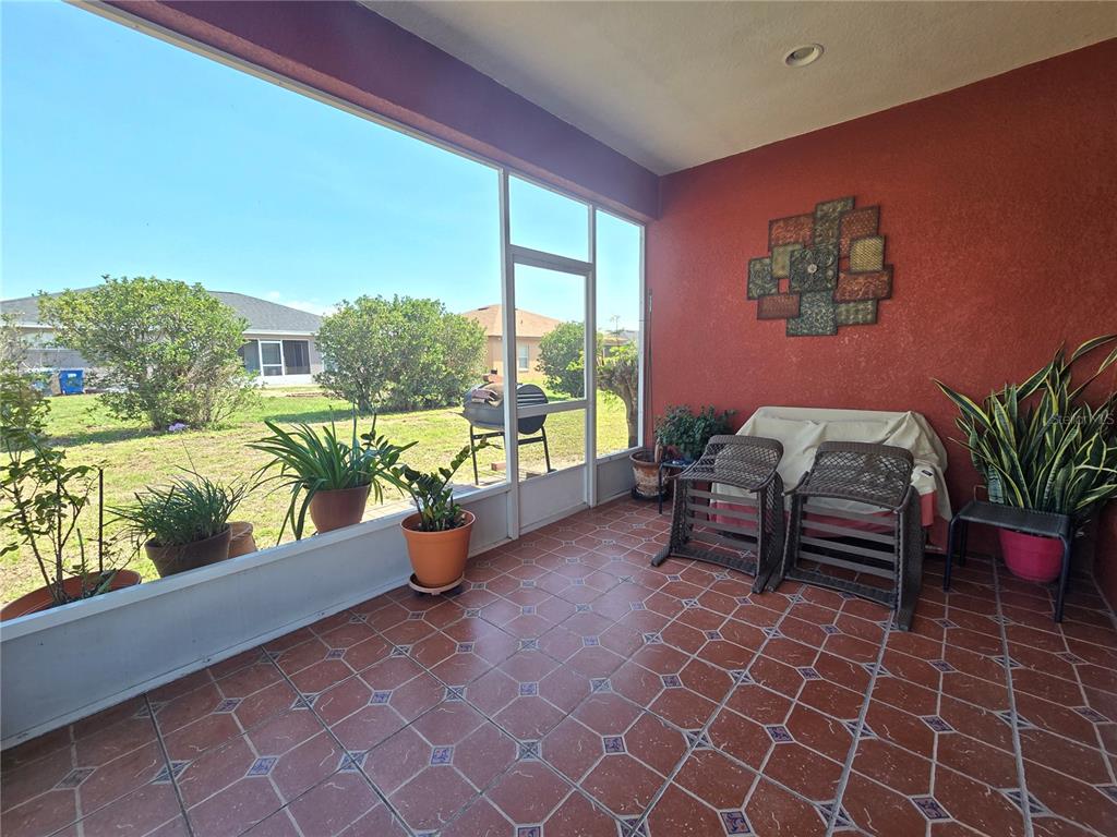 219 Cloverdale Road Winter Haven, FL 33884 - Photo 29 of 29 a view of a porch with chairs and potted plants